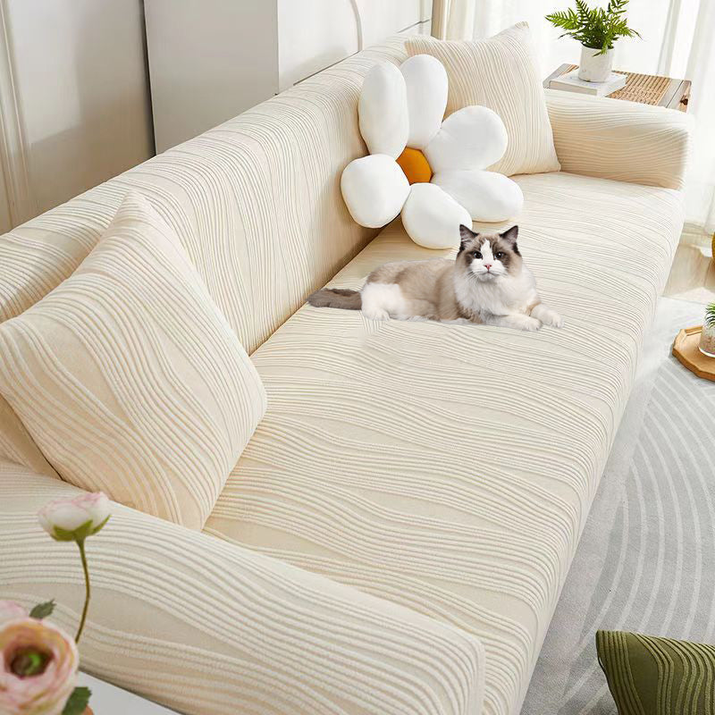 Close-up of jacquard fabric on a stretch sofa cover, premium anti-scratch texture.