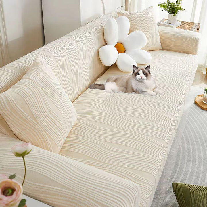 Close-up of jacquard fabric on a stretch sofa cover, premium anti-scratch texture.
