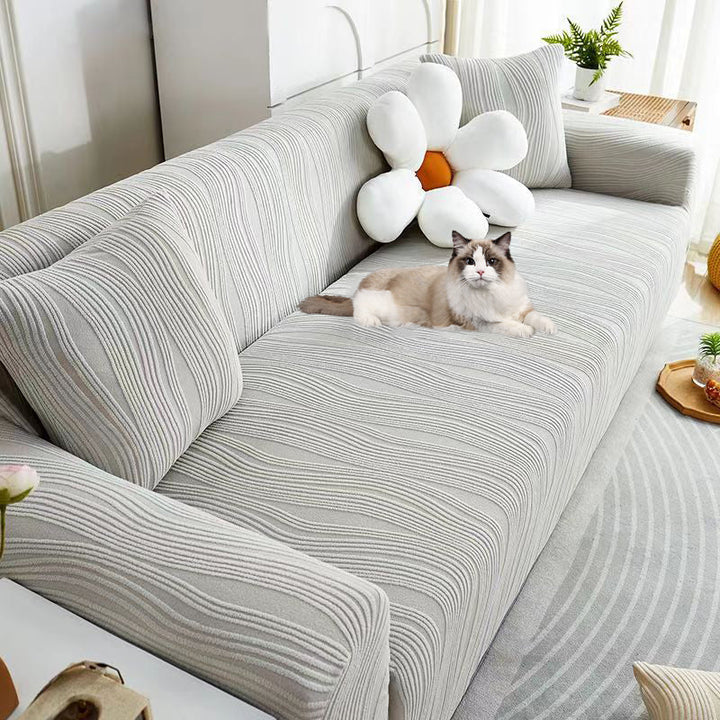 Full view of a living room with a premium jacquard stretch sofa cover, pet-friendly.