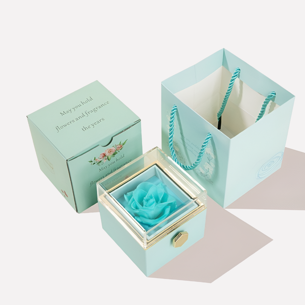 Luxury gift set featuring a preserved pink rose and a heart-shaped necklace with custom engraving.