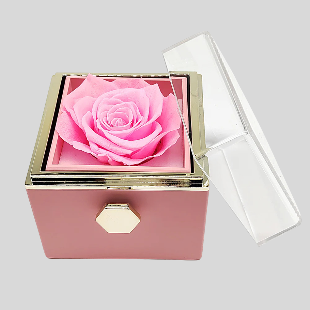Close-up of engraved 'Forever' heart necklace next to a preserved rose, a thoughtful custom jewelry gift.