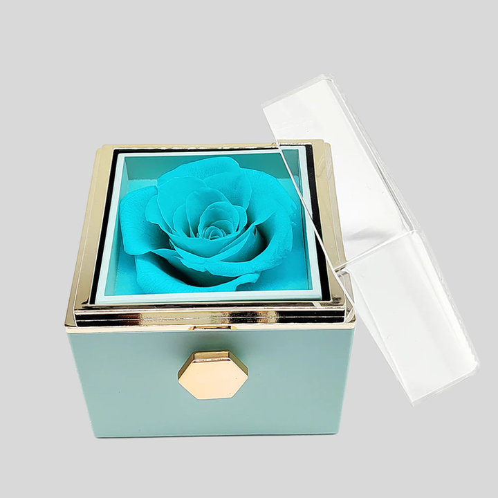 Beautiful preserved rose box containing an engraved heart pendant necklace, ideal personalized gift.