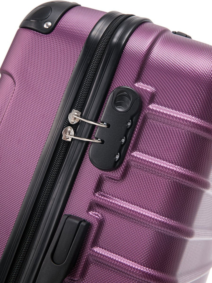 Full view of the two-piece purple hard shell suitcase set, stacked & ready for departure.