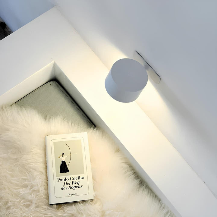 Rechargeable adjustable cordless wall light, modern design for bedrooms & hallways. Magnetic for easy use.