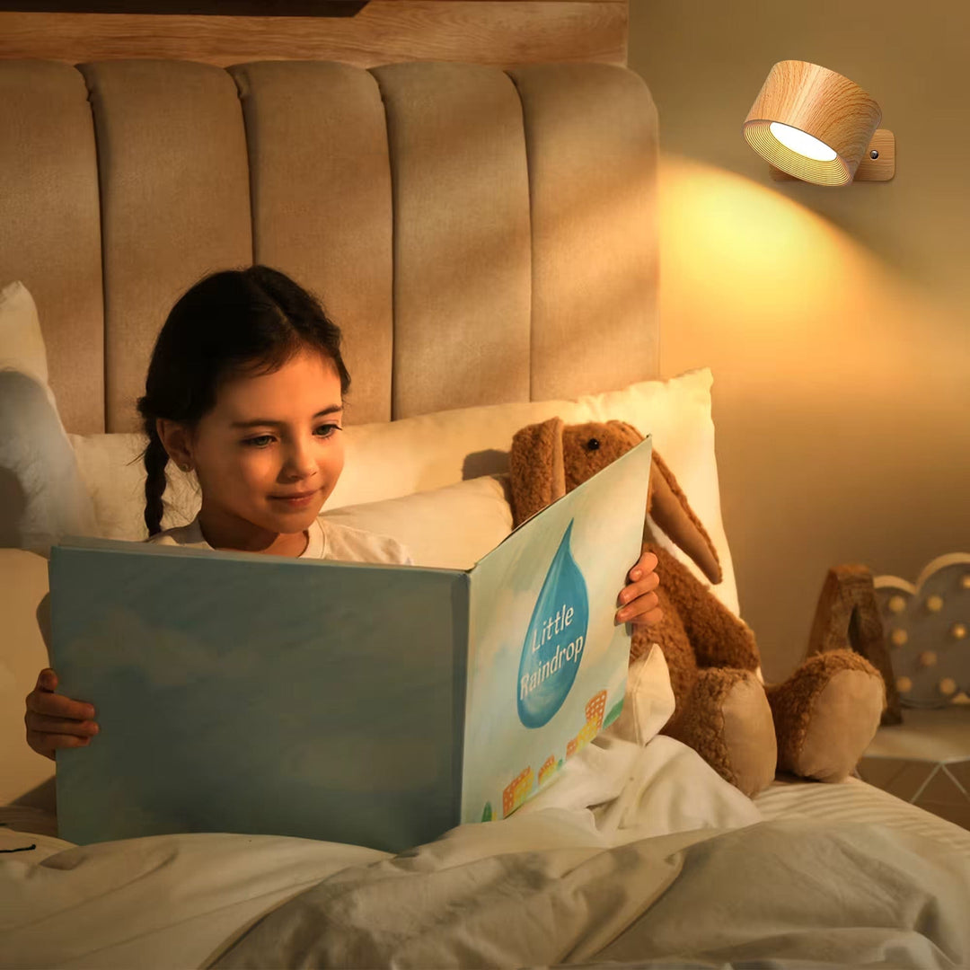 Magnetic adjustable wall lamp, shown being easily attached, providing modern, cordless lighting.