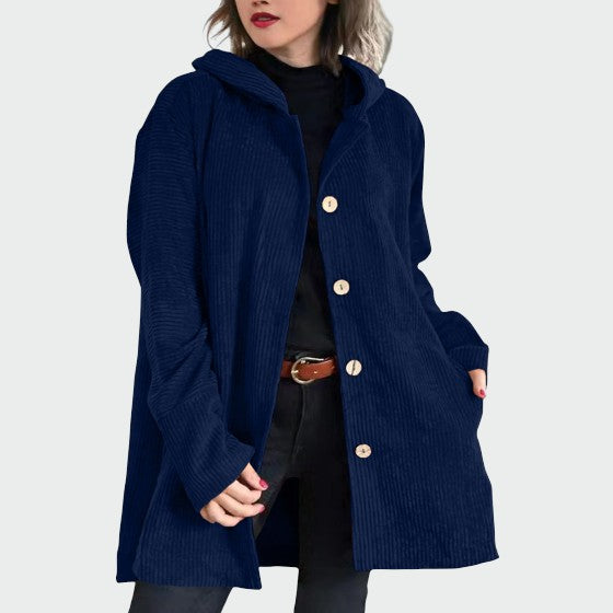 Detail of corduroy fabric on a women's hooded jacket, suitable for fall fashion.