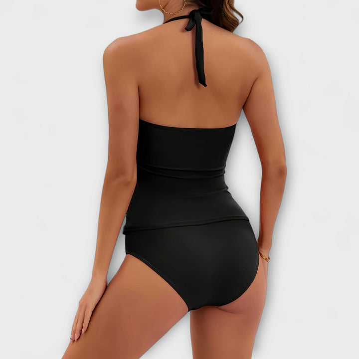 Close-up of a solid halter swimsuit top, showing detailed fabric texture