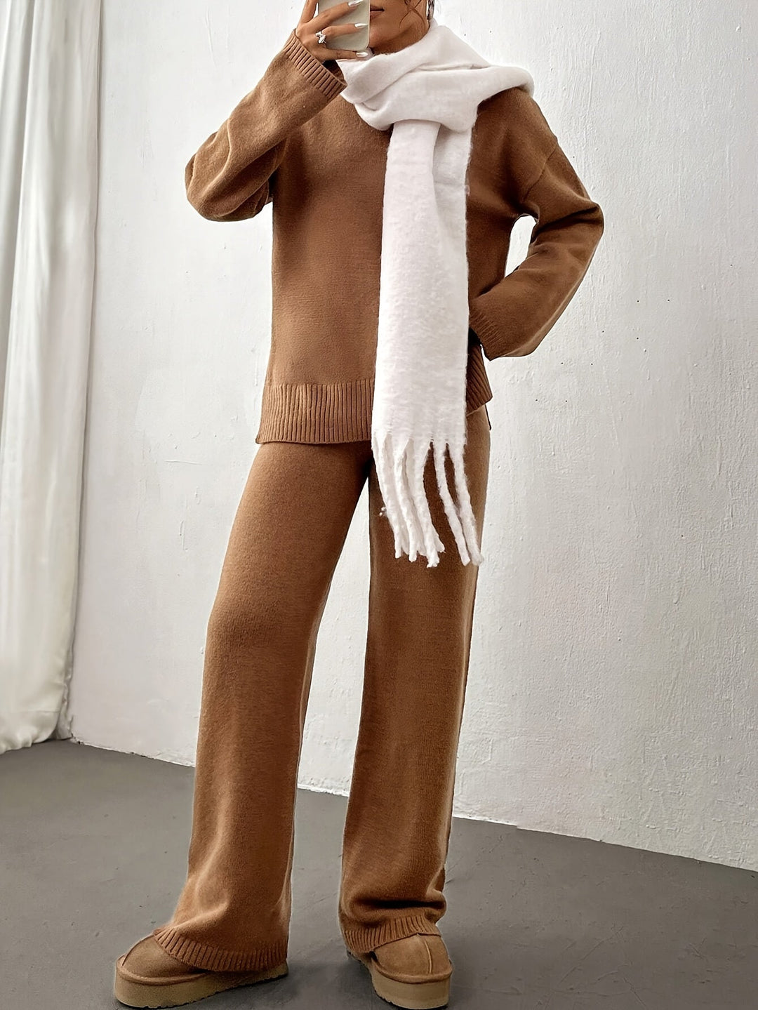 Close-up of fabric detail on a women's beige relaxed fit spring set, soft & comfortable.