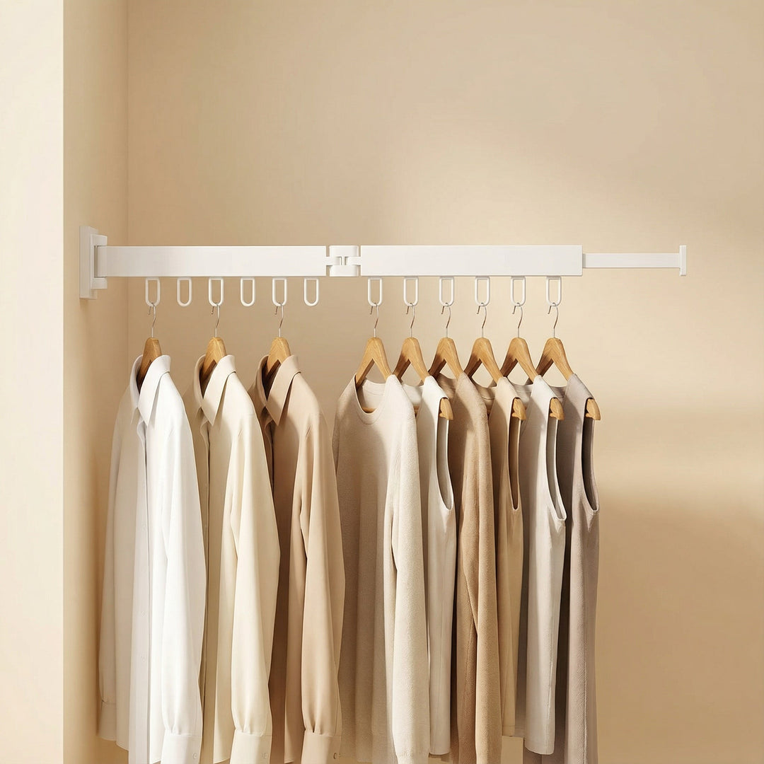 Retractable wall drying rack extended with various clothes, showcasing its full laundry capacity.