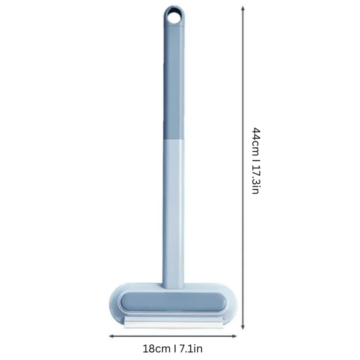 Ergonomic pet hair & lint remover, shown cleaning fur from upholstery. Versatile, reusable home cleaning tool.