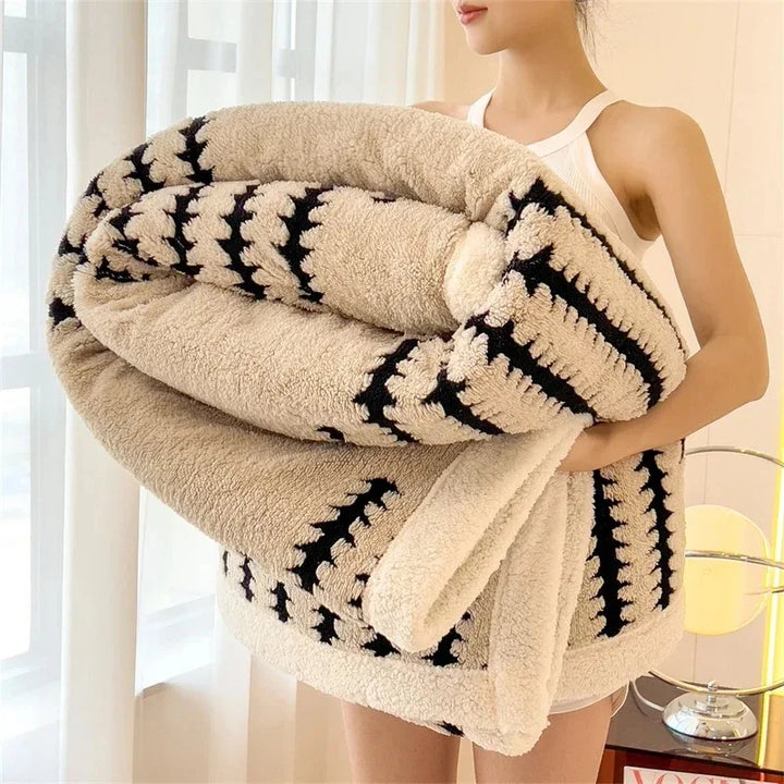 Reversible geometric throw blanket with soft sherpa fleece. Perfect warm home decor accent.