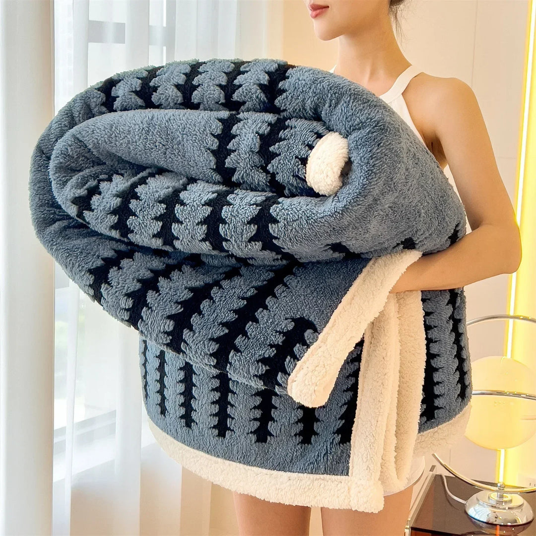 Cozy reversible throw blanket featuring a geometric design & warm sherpa fleece for comfort.