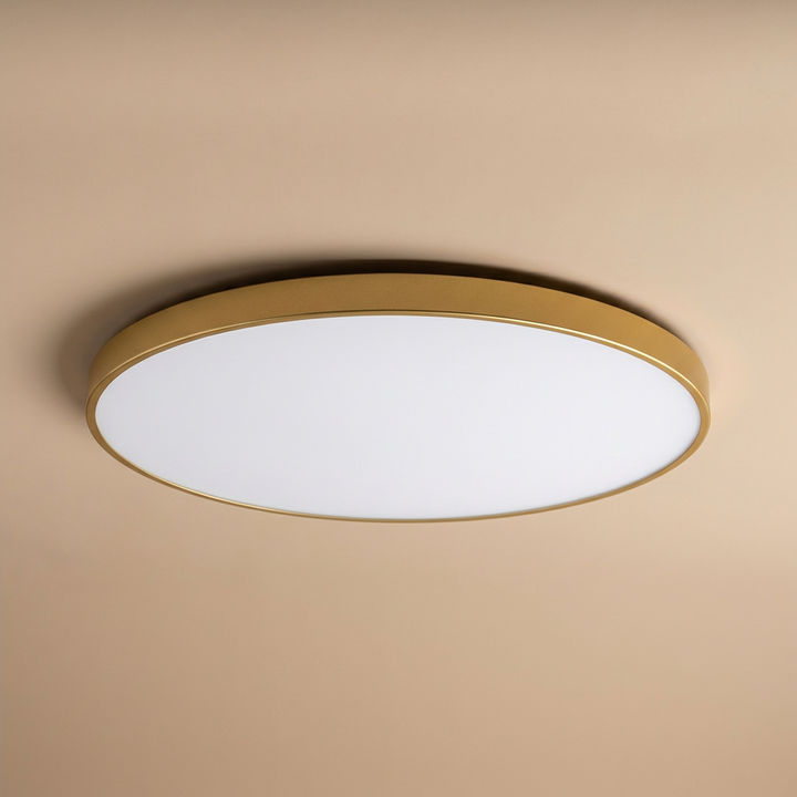 Minimalist round LED ceiling light, slim profile with gold trim, ideal for modern home decor, soft glow.