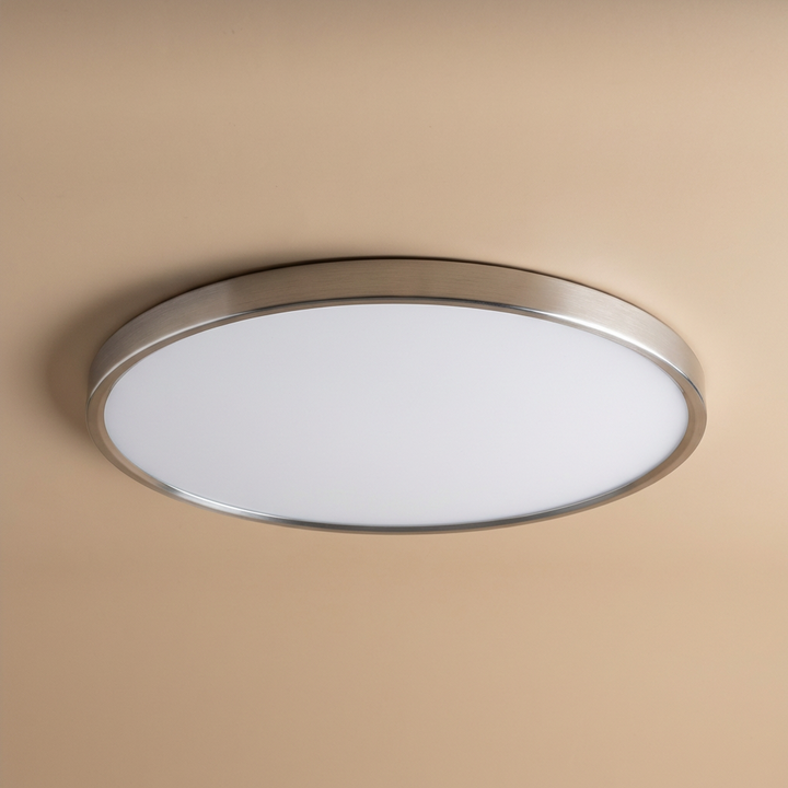 Modern round LED ceiling light, slim design, gold trim, providing soft, energy-efficient interior lighting.
