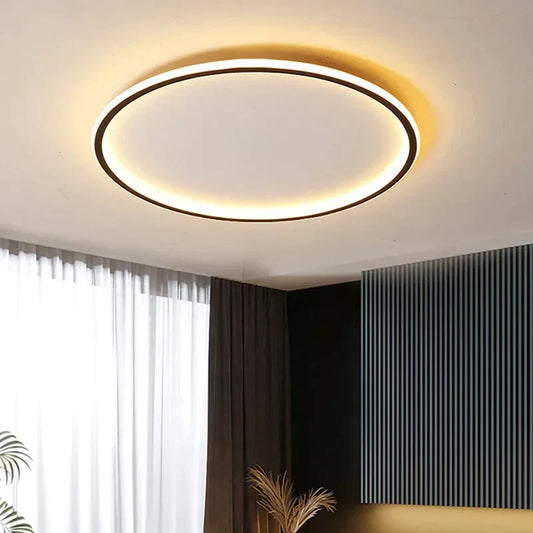 "Round LED ceiling light with Nordic design, offering soft illumination for modern living spaces, made of metal and glass."