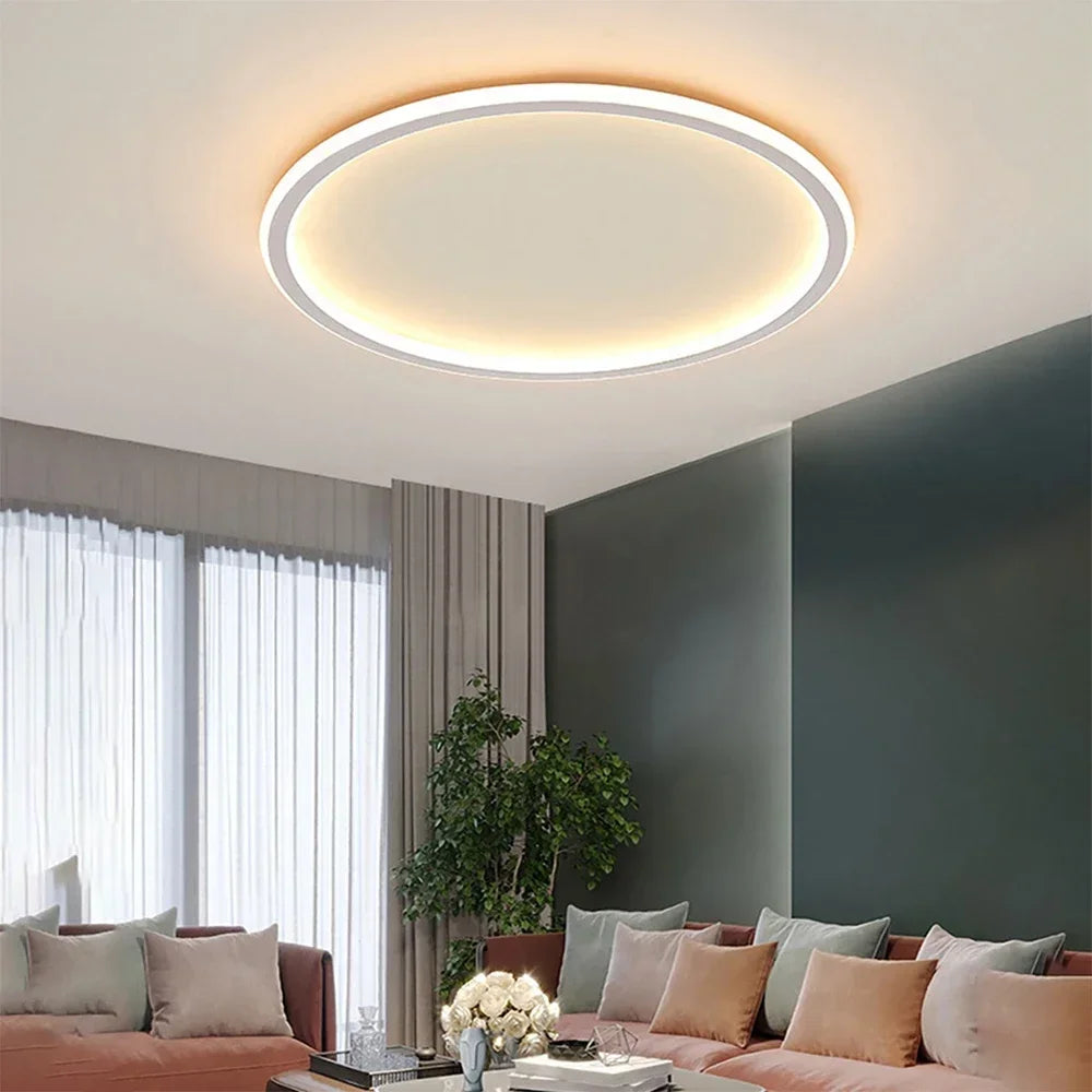 "Round LED ceiling light with Nordic design, offering soft illumination for modern living spaces, made of metal and glass."