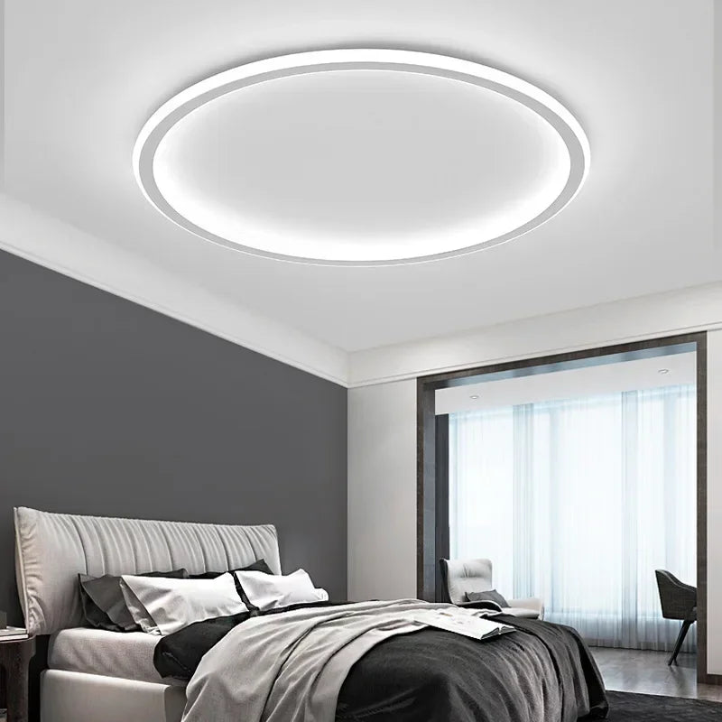 "Round LED ceiling light with Nordic design, offering soft illumination for modern living spaces, made of metal and glass."