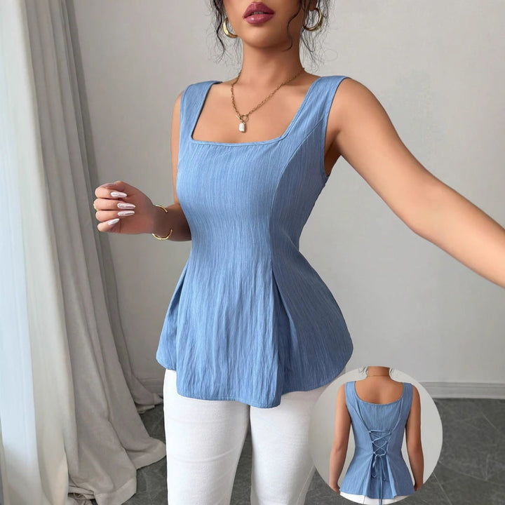 Fashionable sleeveless peplum top in royal blue for women, featuring a chic square neckline and flared hem.