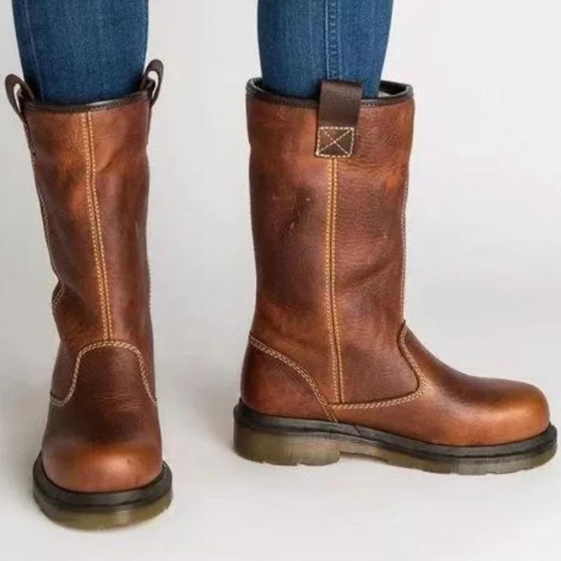 Men's stylish brown pull-on ankle boots. Comfort-focused, rugged design, ideal for casual and winter fashion.