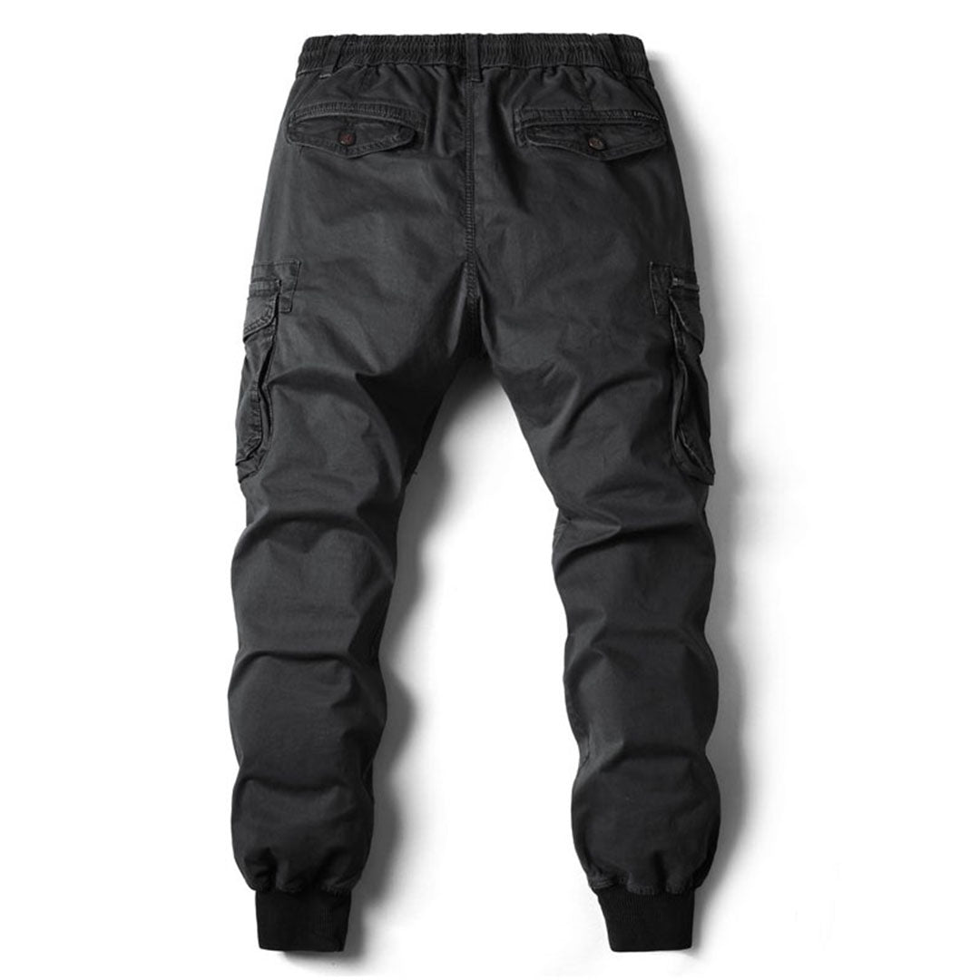 Rugged men's khaki cargo pants with multiple utility pockets for outdoor wear