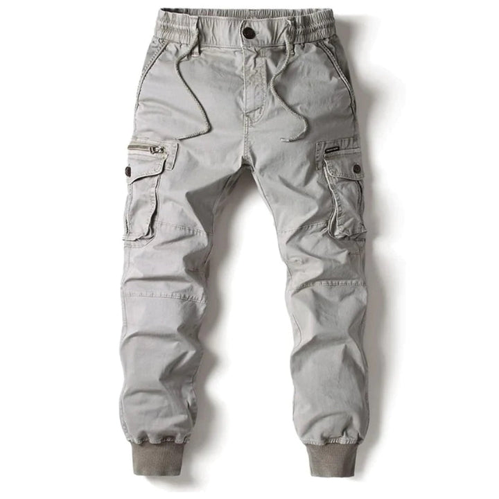 Side view of men's rugged tapered cargo pants in a versatile khaki color