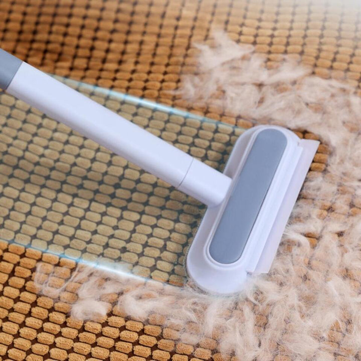 Handheld pet hair remover for effective cat & dog fur cleaning on clothes, beds & fabric.