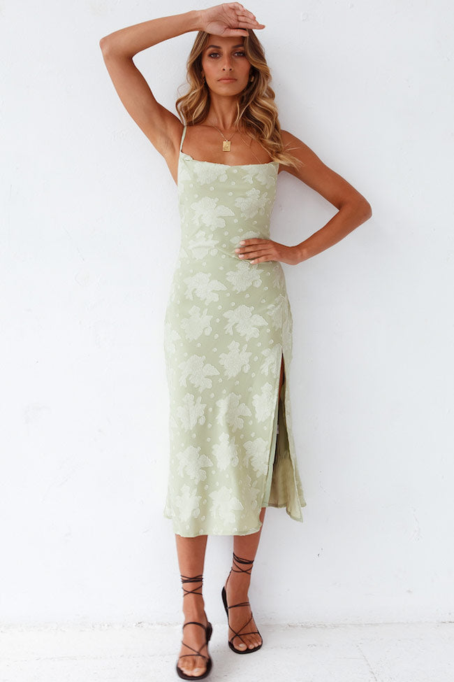 Women's orange floral cowl neck slip midi dress with a stylish high slit, perfect for evening events.