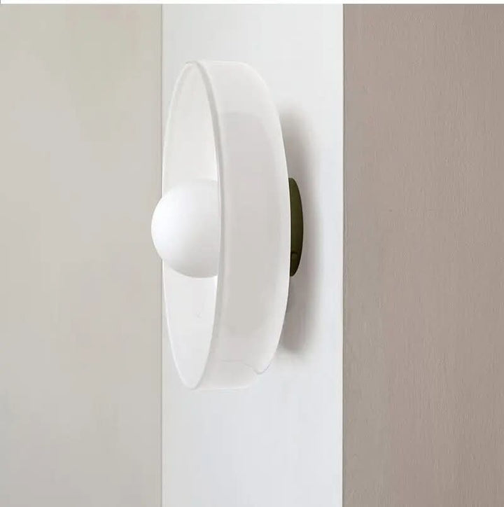 Round Scandinavian glass ceiling lamp, minimalist design provides modern ambient lighting.
