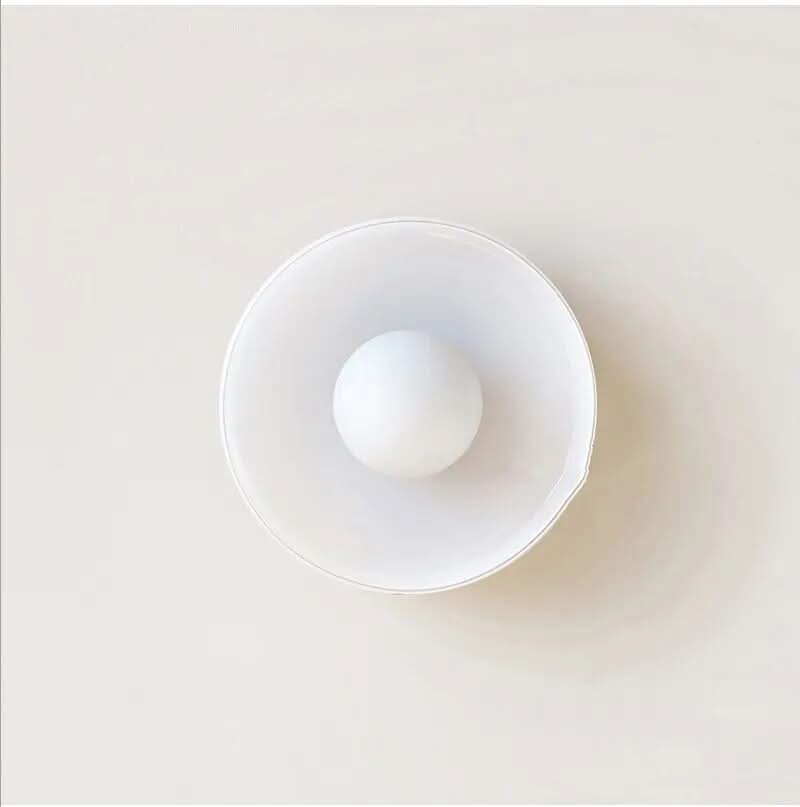 Unique clear glass Scandinavian ceiling lamp detail, enhancing modern home interior lighting.