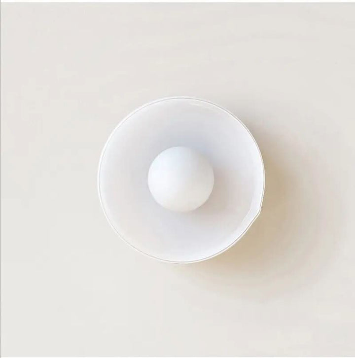Unique clear glass Scandinavian ceiling lamp detail, enhancing modern home interior lighting.