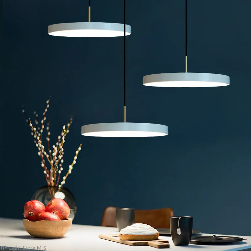 Contemporary ceiling pendant lamp, sleek metal and glass, providing ambient warm & white light for any room.