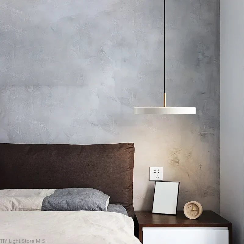 Chic Scandinavian-style pendant light, minimalist aesthetic, ideal for modern home decor with warm lighting.