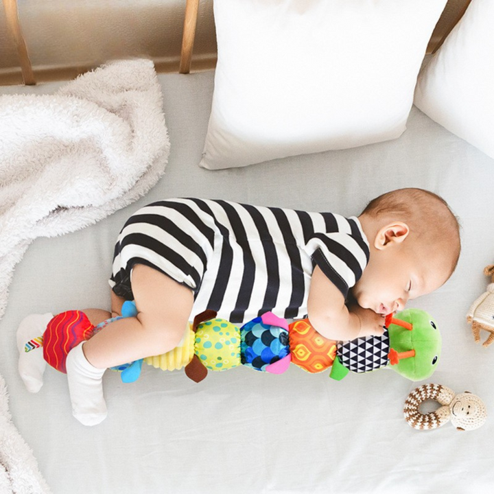 Sensory musical plush caterpillar toy for babies, perfect for infant development, stimulating motor skills & senses.