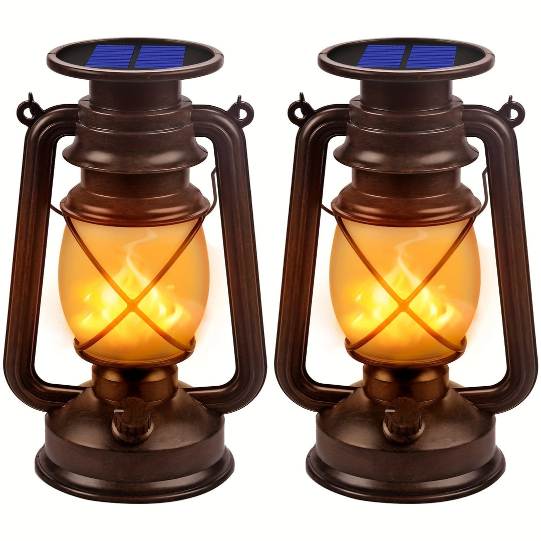 Set of 2 solar dancing flame LED lanterns, perfect for charming garden decor & patio ambiance.
