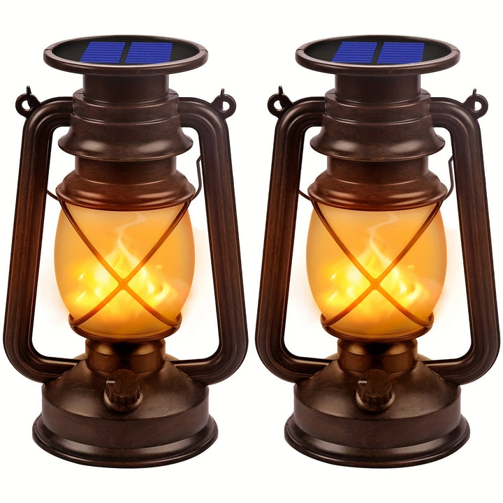 Set of 2 solar dancing flame LED lanterns, perfect for charming garden decor & patio ambiance.