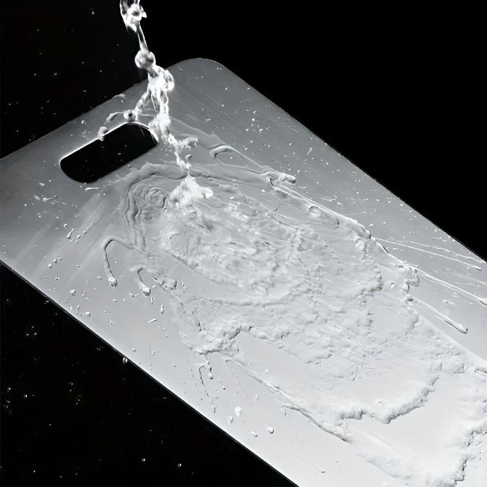 New hygienic stainless steel cutting board in silver, kitchen grade for food preparation
