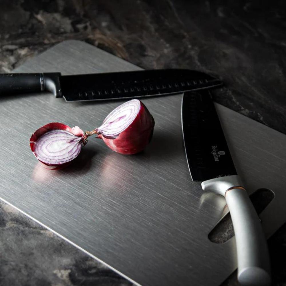 Sleek silver stainless steel cutting board, hygienic and durable for all kitchen chopping needs