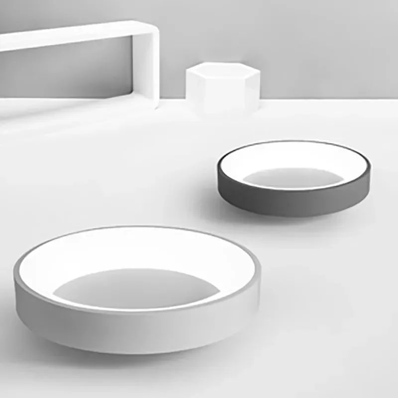 Contemporary Nordic LED ceiling light. Sleek round fixture, provides bright and energy-efficient home illumination.