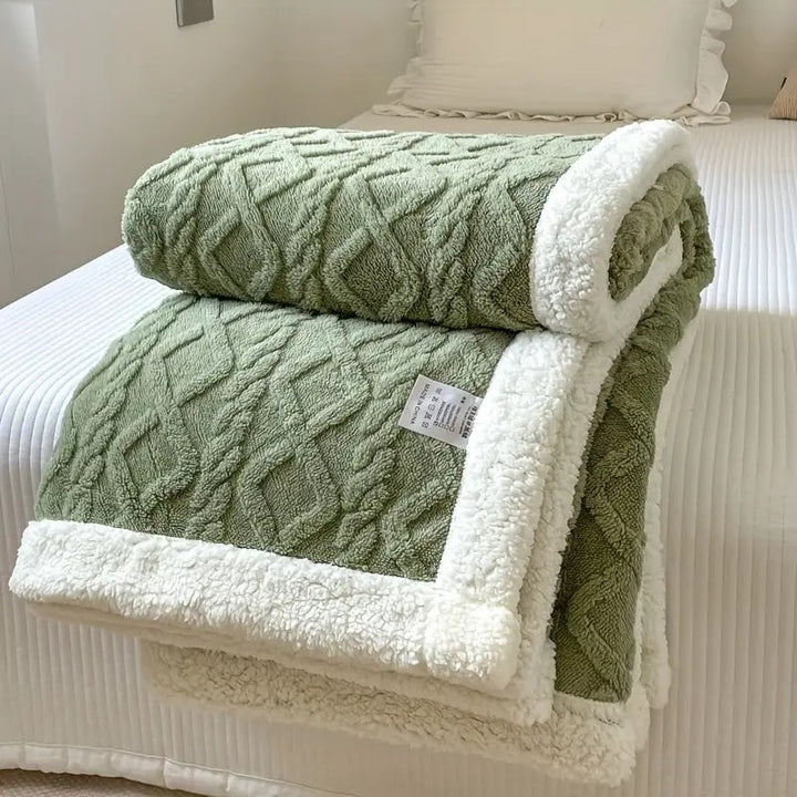 Luxurious sherpa fleece throw, soft and cozy bed blanket. Reversible design for stylish all-season home decor.