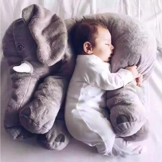 Soft baby elephant plush toy pillow, perfect for snuggles & comfort in a nursery. Ideal newborn gift & cuddle pal.
