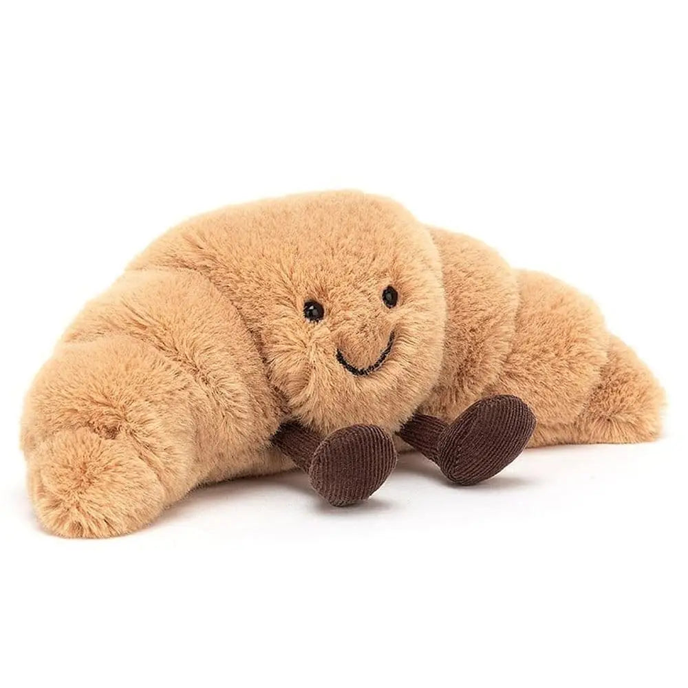 Cuddly beige croissant plush toy, a kawaii stuffed animal hug pillow for cozy home decor or a sweet gift.