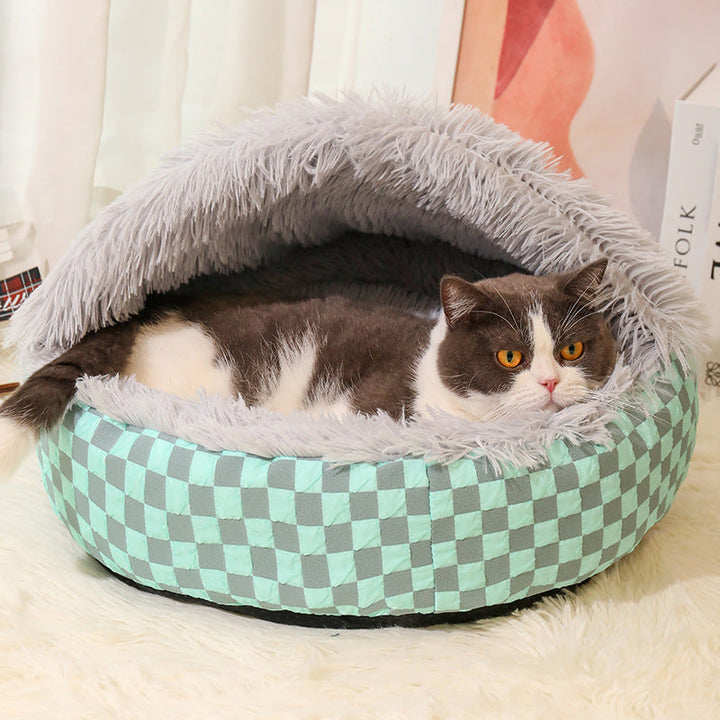 Warm plaid cat bed in a cave design offers ultimate feline comfort & a secure space. Washable pet accessory.