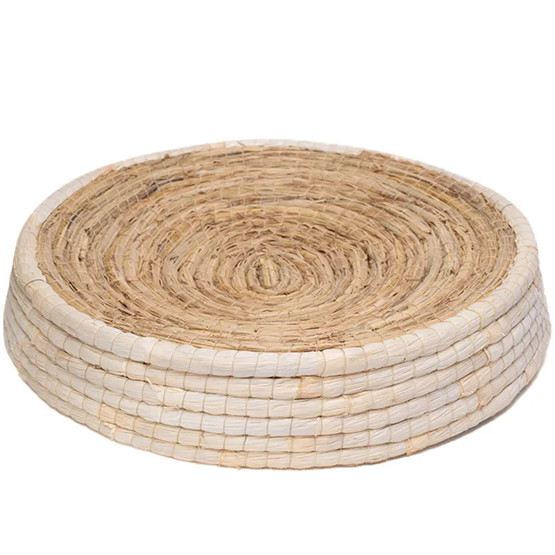 Durable round cat bed, woven from natural, eco-friendly materials, offers a soft nest for sleep & satisfies paw-friendly instincts.
