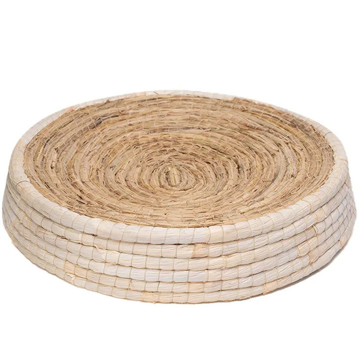 Durable round cat bed, woven from natural, eco-friendly materials, offers a soft nest for sleep & satisfies paw-friendly instincts.