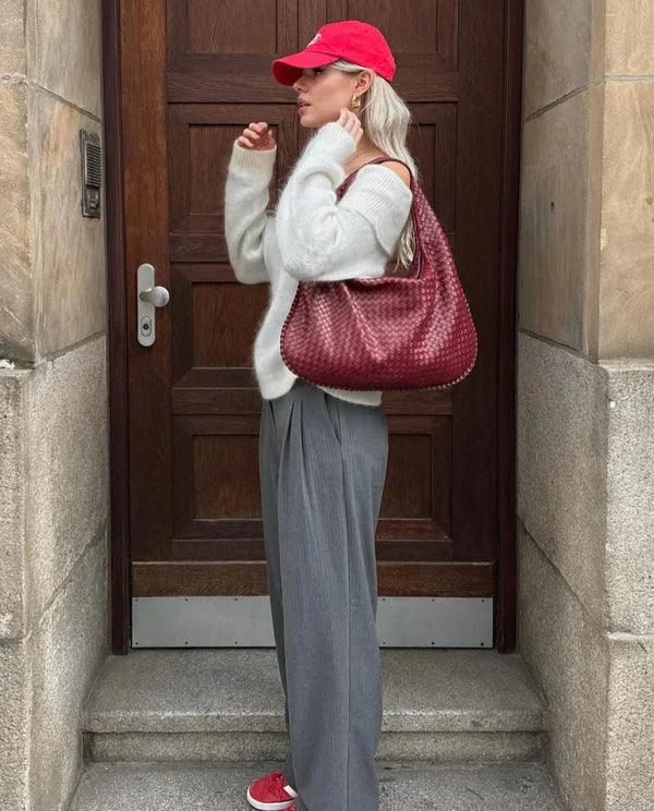 Fashionable women's slouch bag, featuring a unique woven design in soft vegan leather.