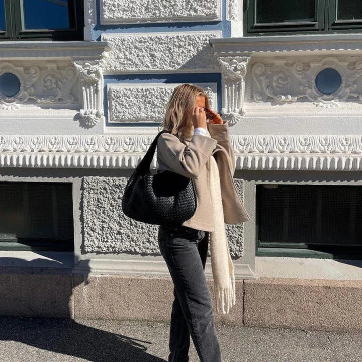 Versatile women's everyday shoulder bag, made from soft vegan leather with a trendy woven texture.
