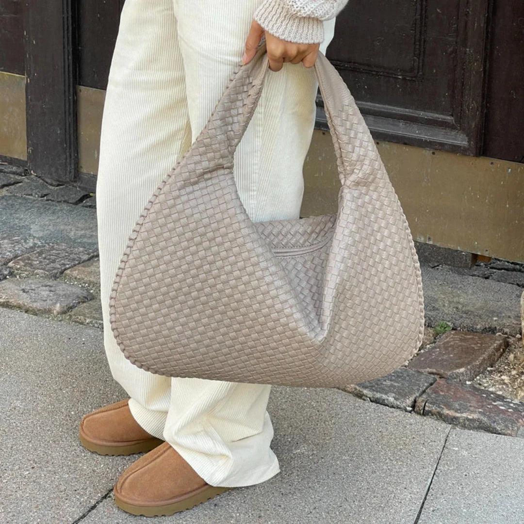 Chic women's soft vegan leather bag, slouchy woven shoulder design, a must-have fashion accessory.