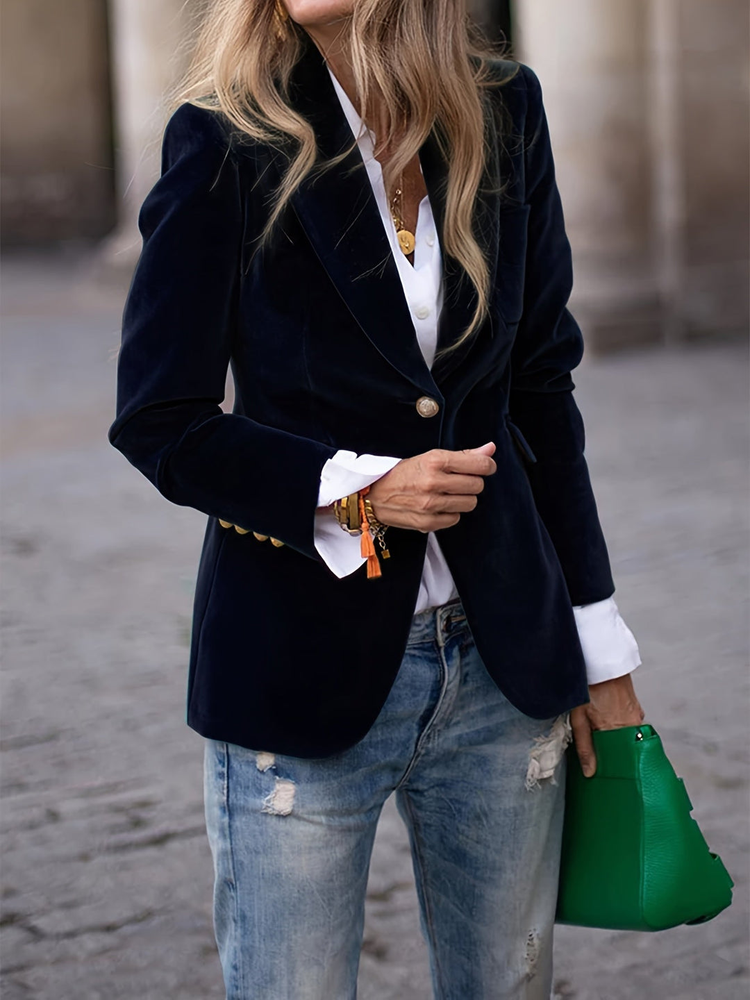 Stylish women's black tailored blazer featuring a single-button front, a versatile piece for professional work attire.