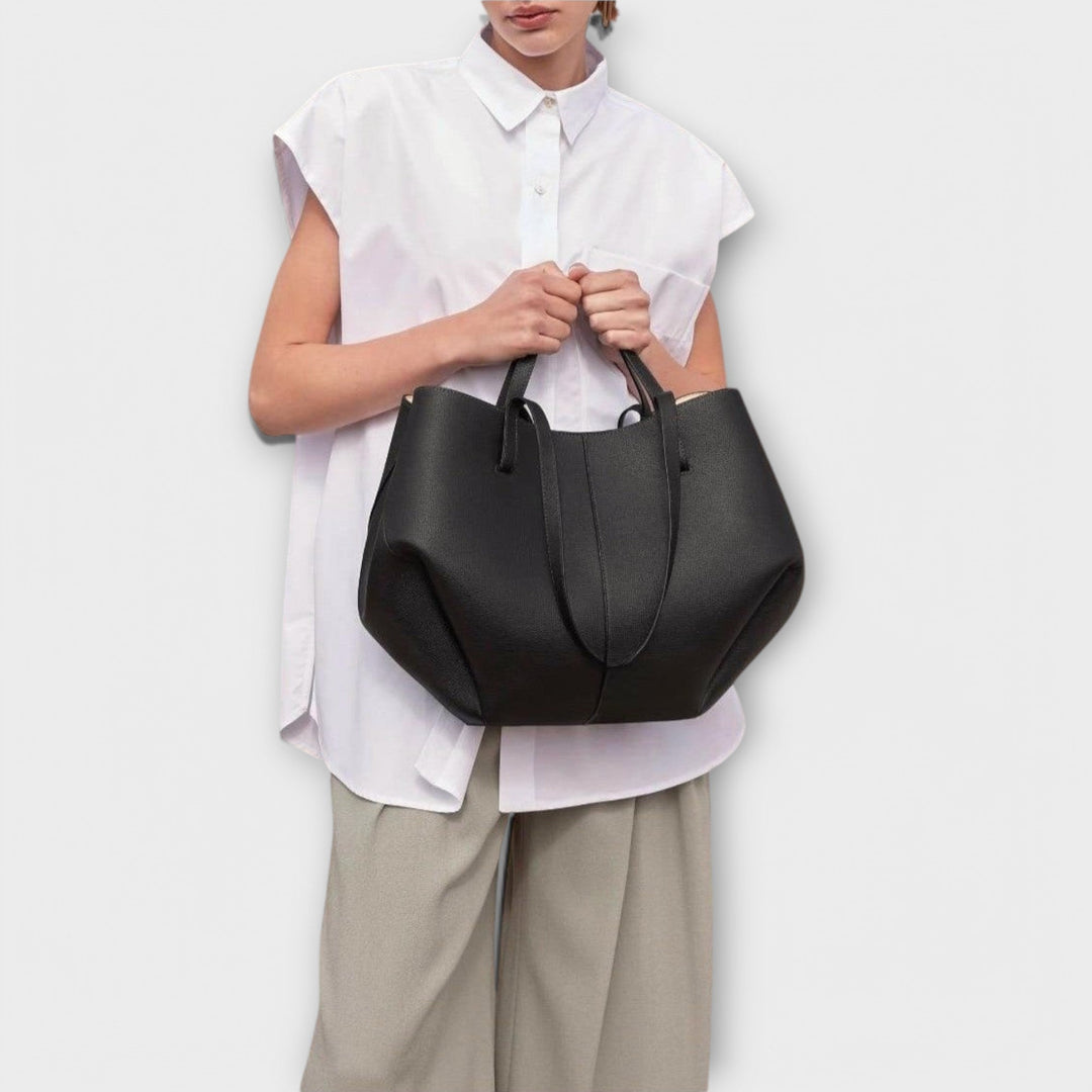 Everyday fashion tote bag in neutral hue, durable vegan leather, close-up of stitching