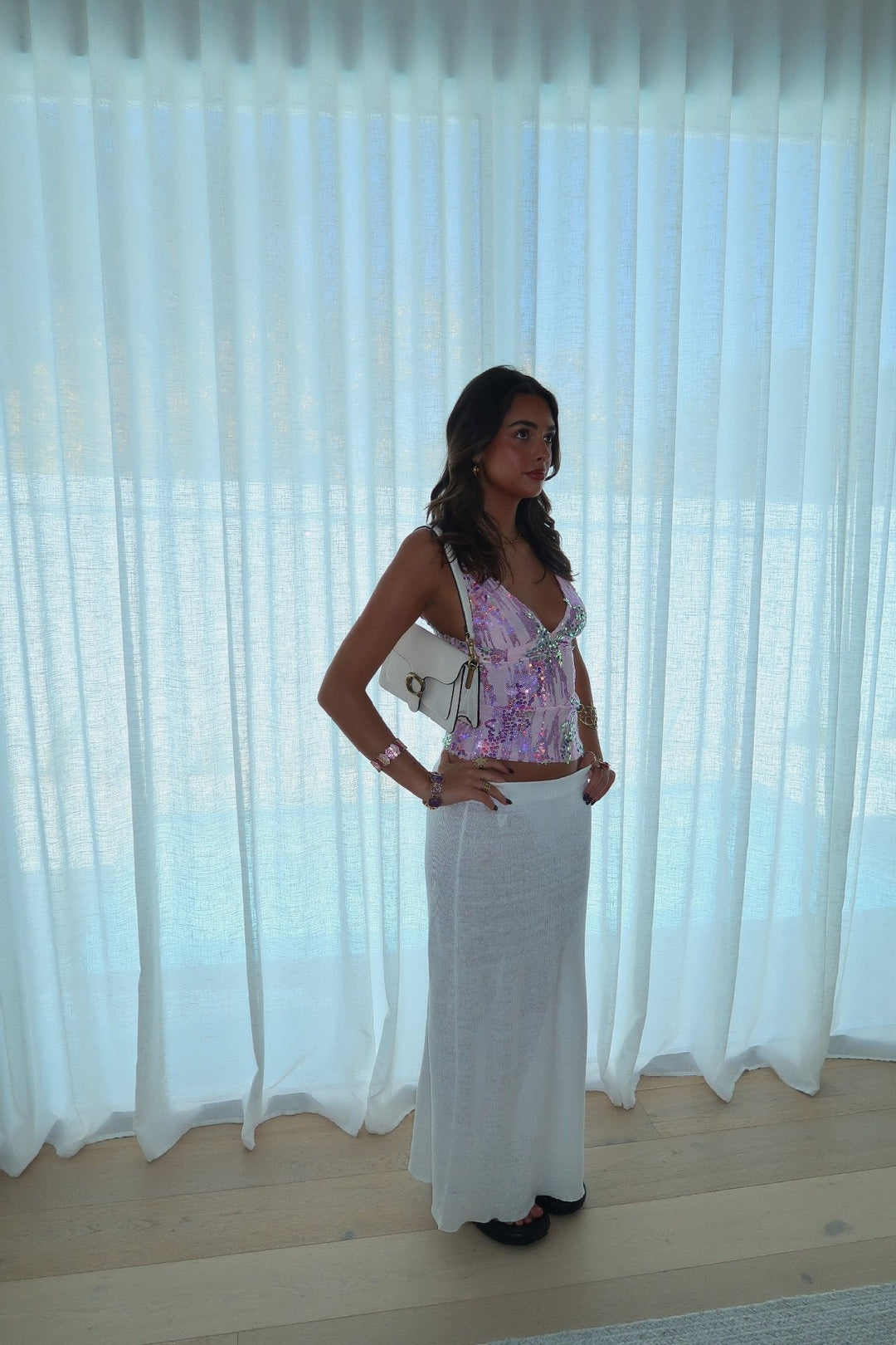 Dazzling sleeveless sequin top with a V-neck, suitable for women's party wear